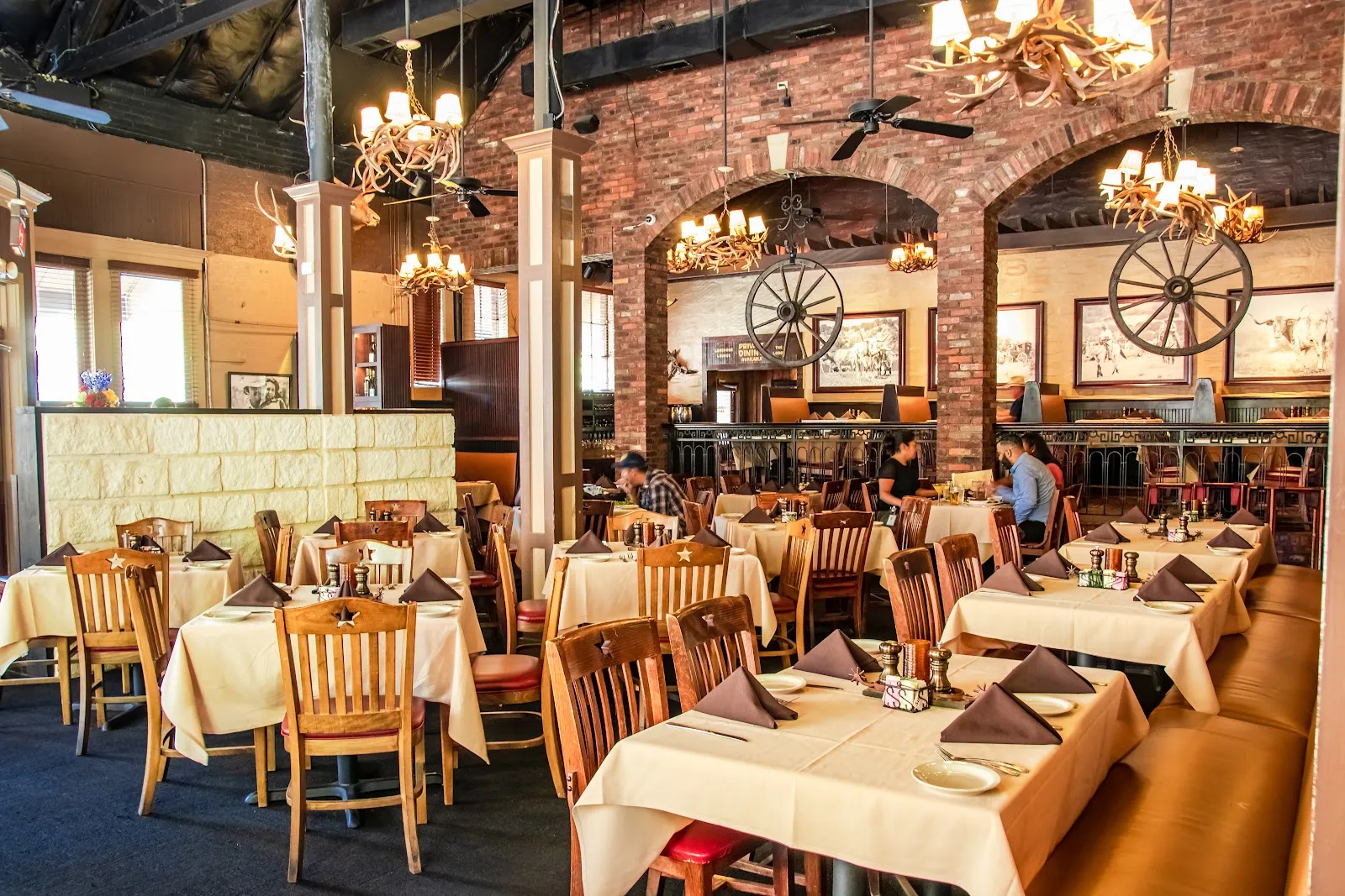 Wood-panelled dining room at Y.O. Ranch Steakhouse, West End, Dallas
