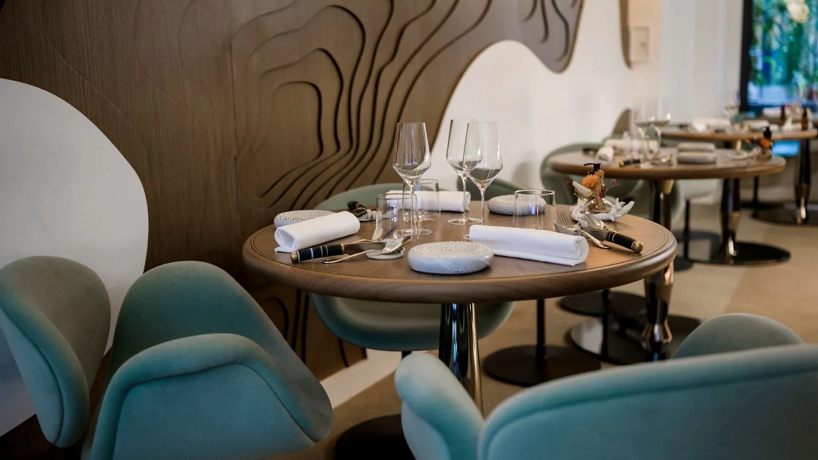 Stone walled dining room at Granite, rue Bailleul, Paris