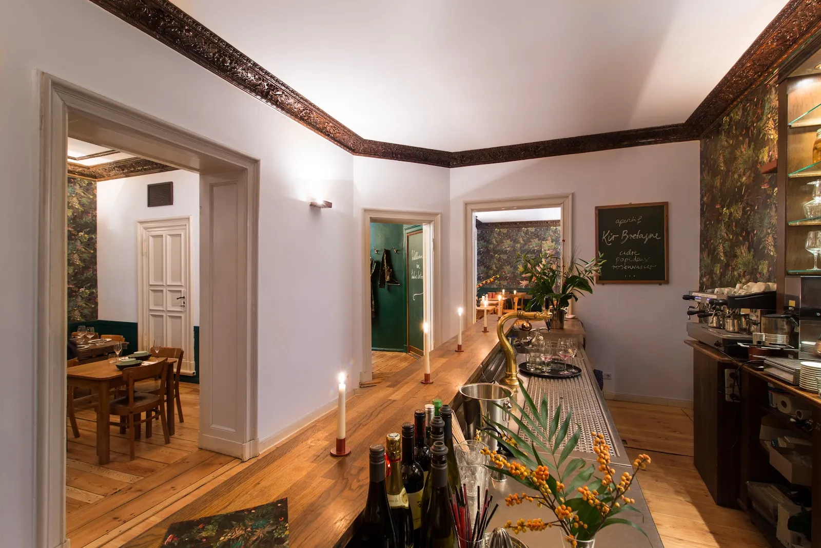 A warmly lit two-top in an intimate Berlin restaurant