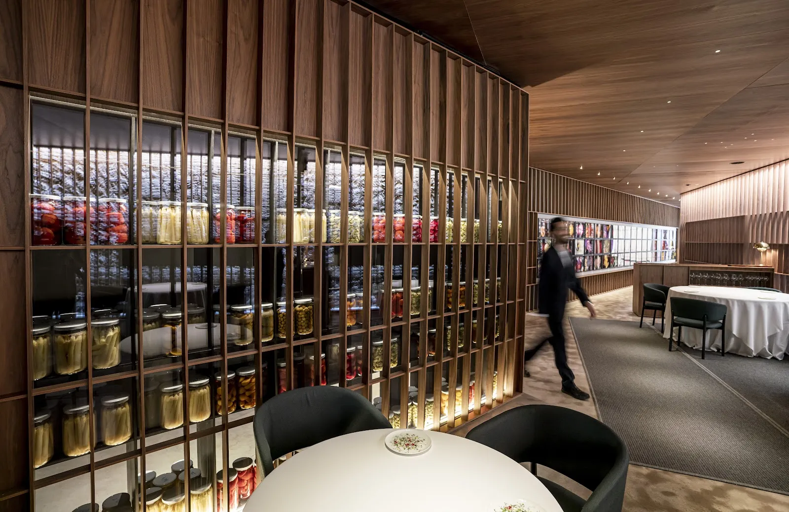 A single diner at a marble tapas counter inside a market hall in Valencia