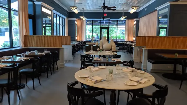 Le Politique Austin downtown French brasserie zinc bar leather banquette steak frites interior
