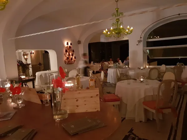 Le Monzù Hotel Punta Tragara Capri one Michelin star chef Pedana terrace dining Mediterranean coastal views