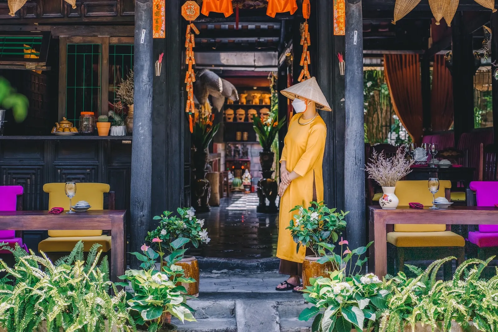Yellow-walled 100-year-old dining room at Châu Kitchen & Bar, 141 Tran Phu, Hoi An