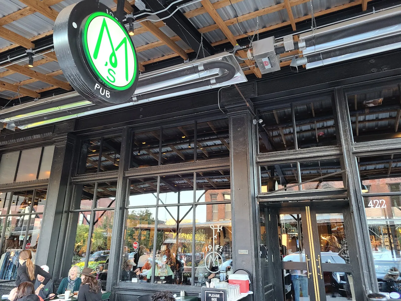 Warm brick-walled bistro dining room at M's Pub in Omaha's Old Market