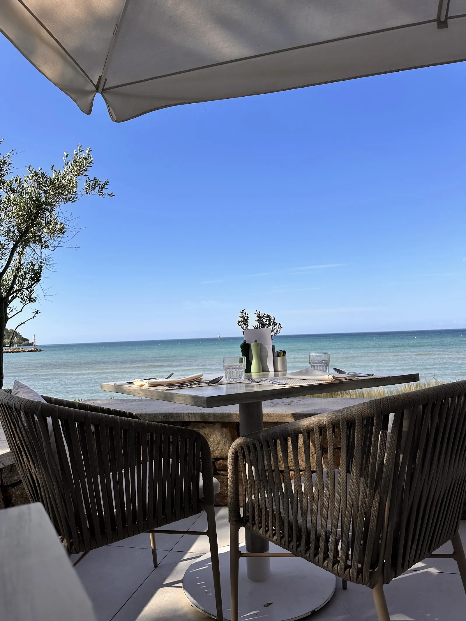 Beachfront tables on the sand at Ammos, Sani Resort, Halkidiki
